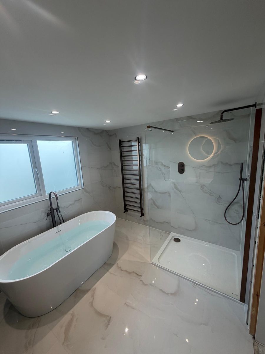 Bathroom installation in Leigh — Calacatta marble with a freestanding bath and walk-in shower, by Flow Heat Plumbing & Heating